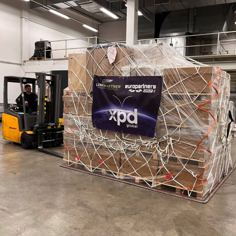 One of the cargo consolidations for this great oversized logistic project for the Automotive Industry with xpd global banner over it.