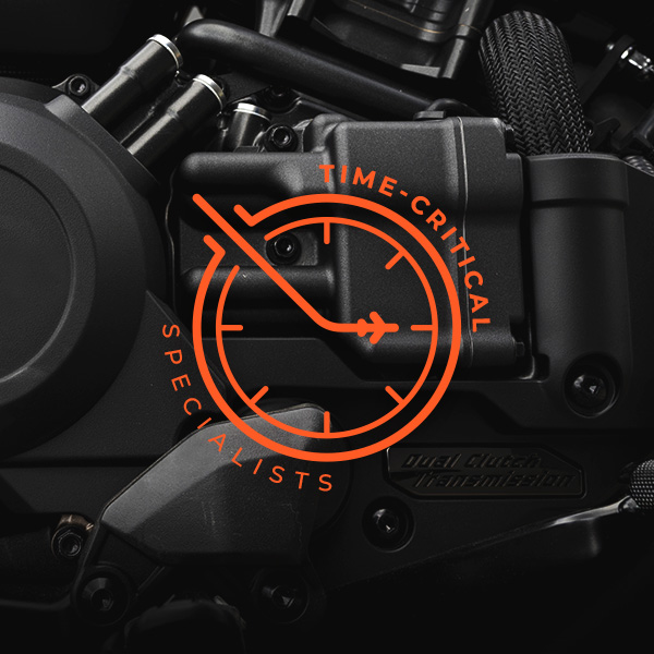xpd global’s time critical specialists in orange over automotive parts painted in back. Access the article to read a case study about air priority solutions to delivery time critical cargo to assembly plants and just-in-sequence supply chains.